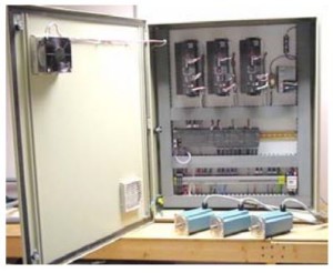 Industrial control panel with drives and three servo motors wired for a multi-axis machine.